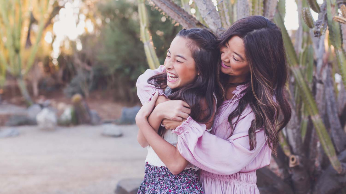 Happy mother and daughter hugging