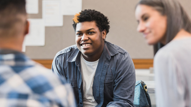 Teenager smiling in a group